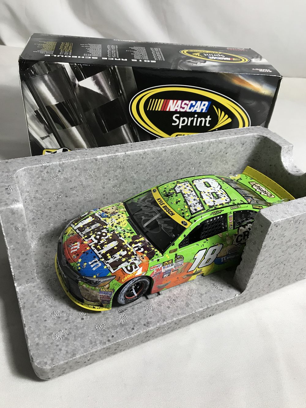Lot 21: Autographed Raced Version Kyle Busch Homestead Win