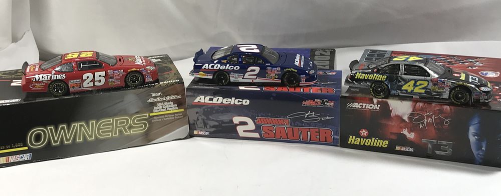 Lot 827: 3 Diecast Collectible Racing Cars in org boxes
