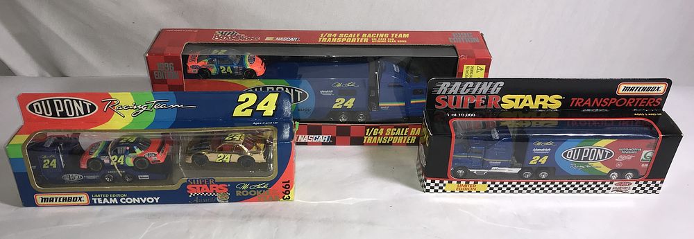 Lot 583: Jeff Gordon 24 Dupont transporters & stock cars