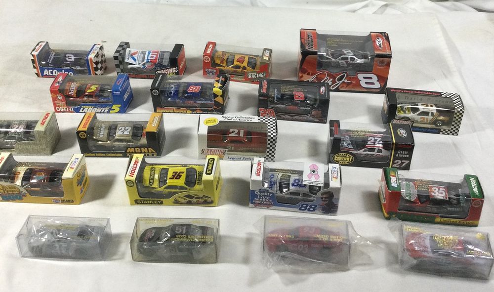 Lot 1352: 20 toy race cars all packages sealed various