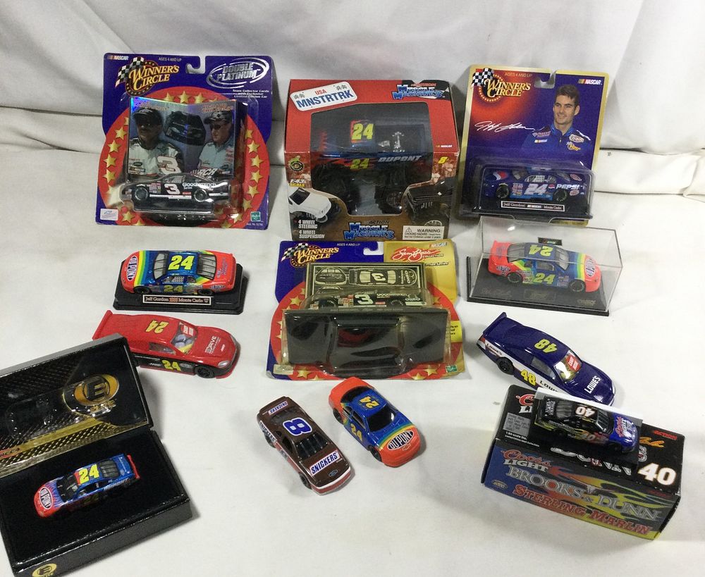 Lot 1371: 12 toy race cars including truck ,some large and