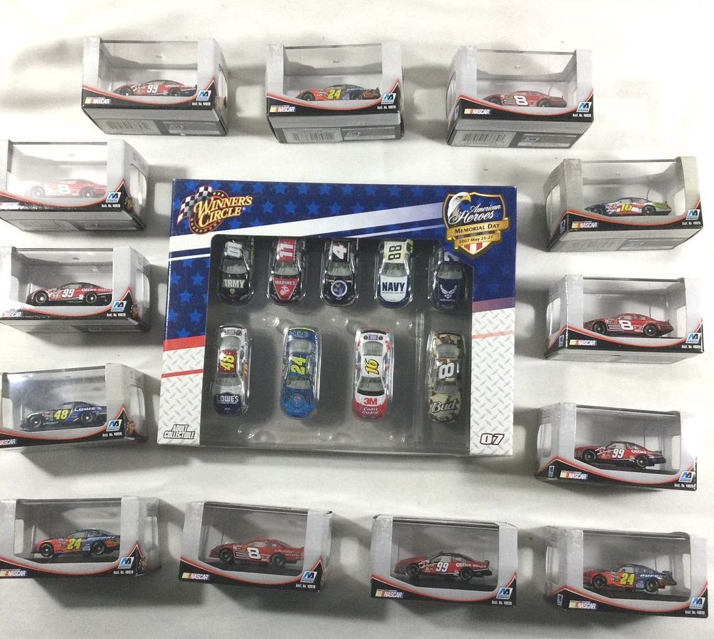 Lot 1377: 22 Toy race cars in original packaging
