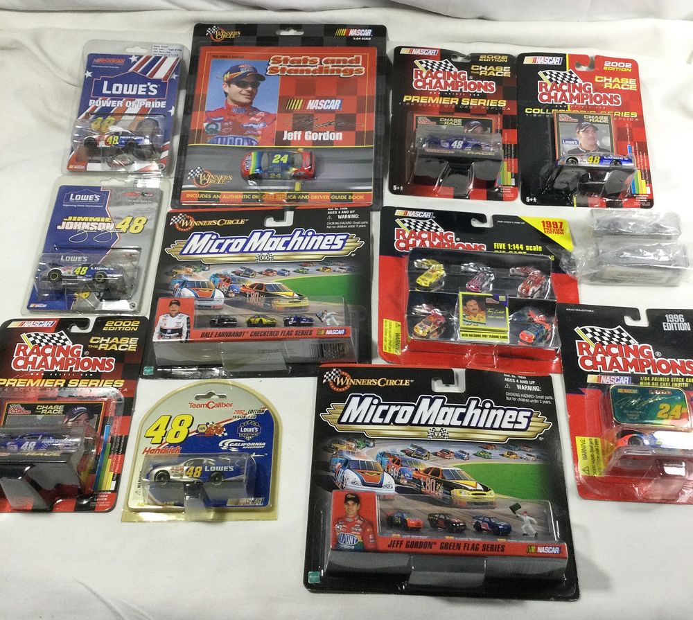Lot 1378: 21 toy race cars sealed packages ,various