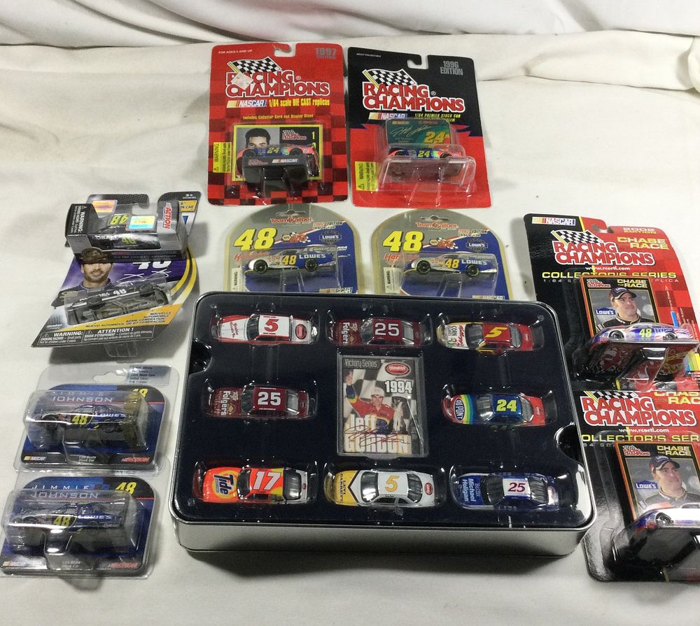Lot 1379: 18 toy race cars sealed in original packaging