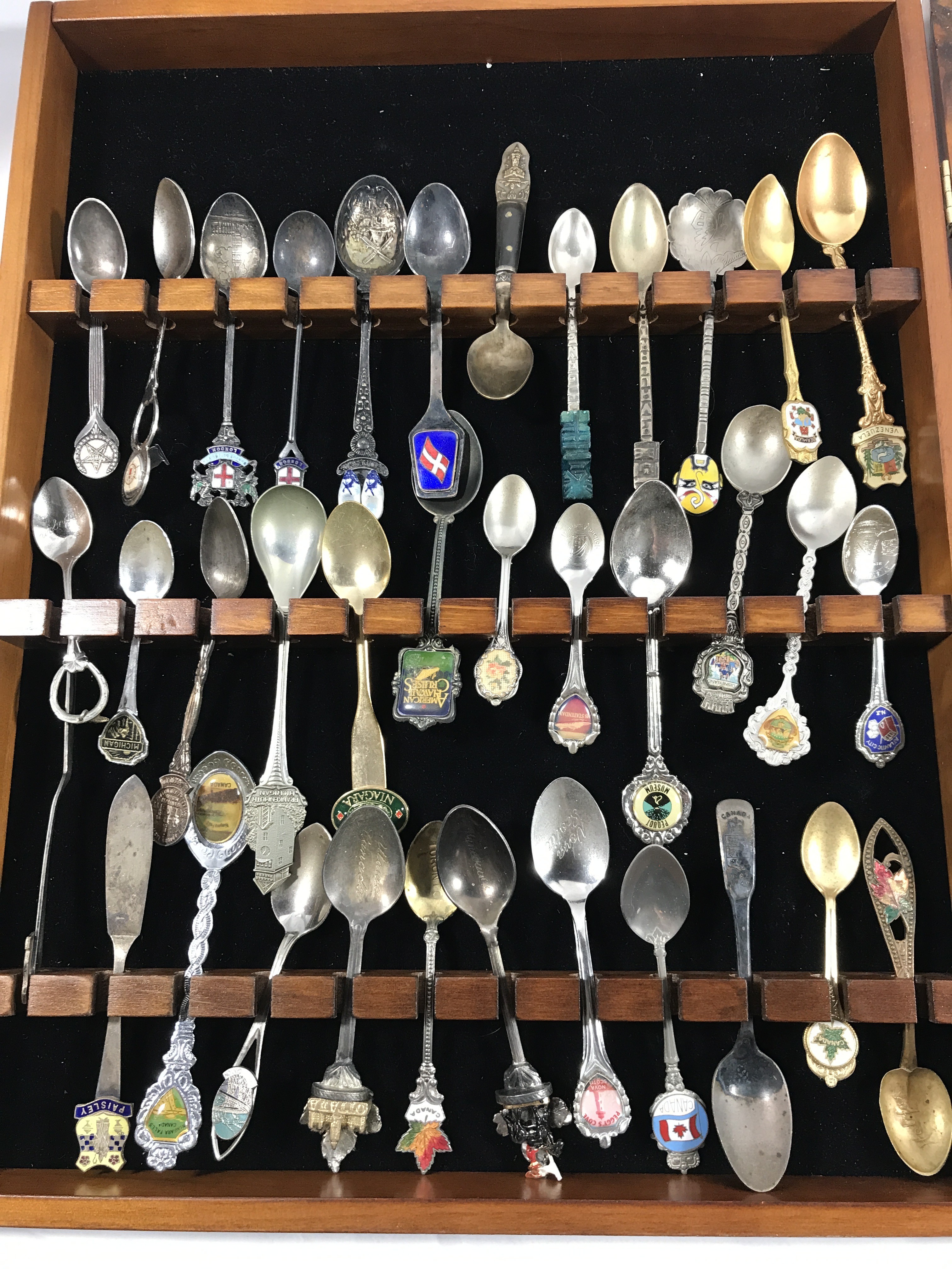 Vintage souvenir, spoon collection in wood display