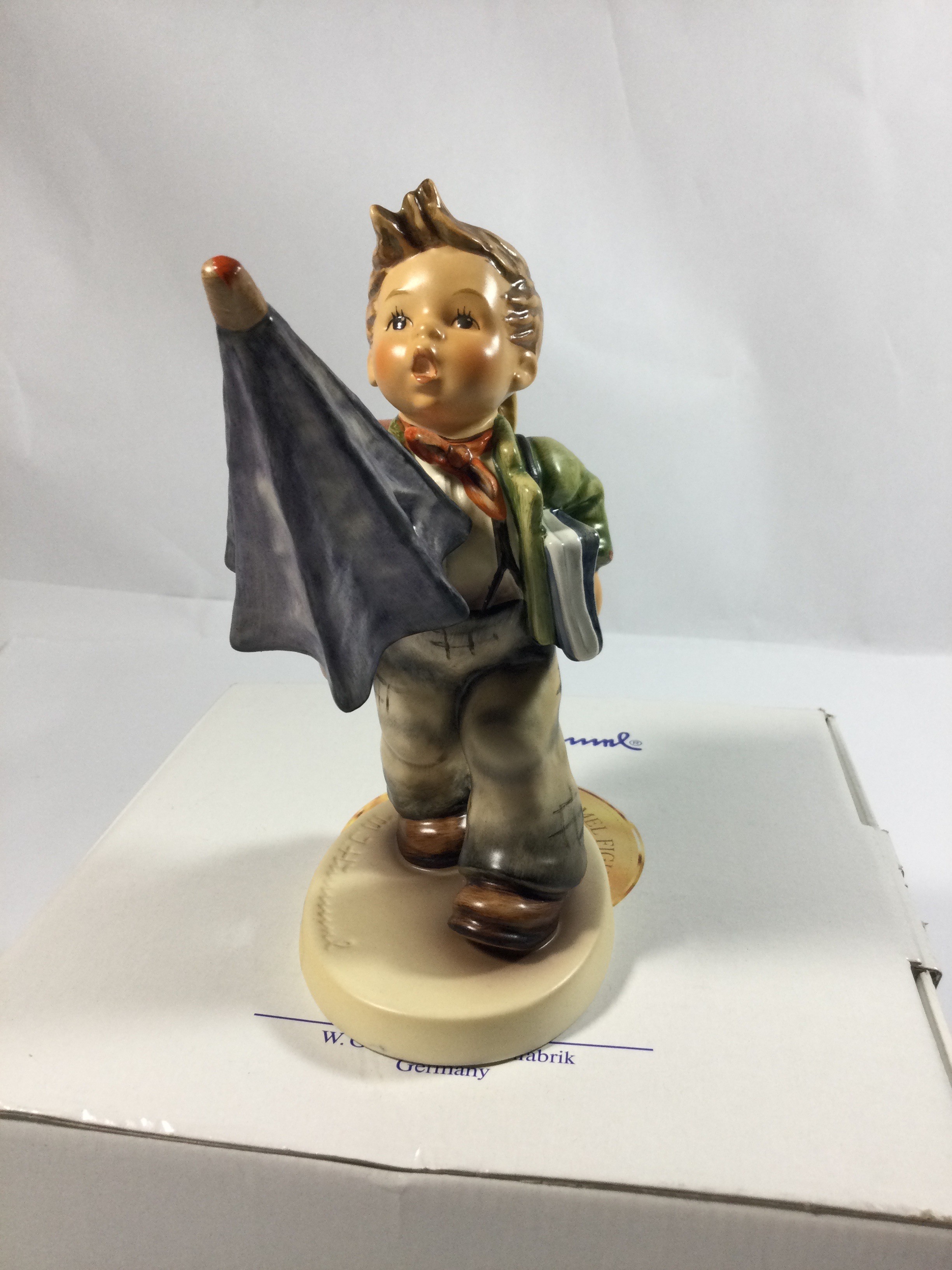 Collectible Hummel Figurine titled Is It Raining