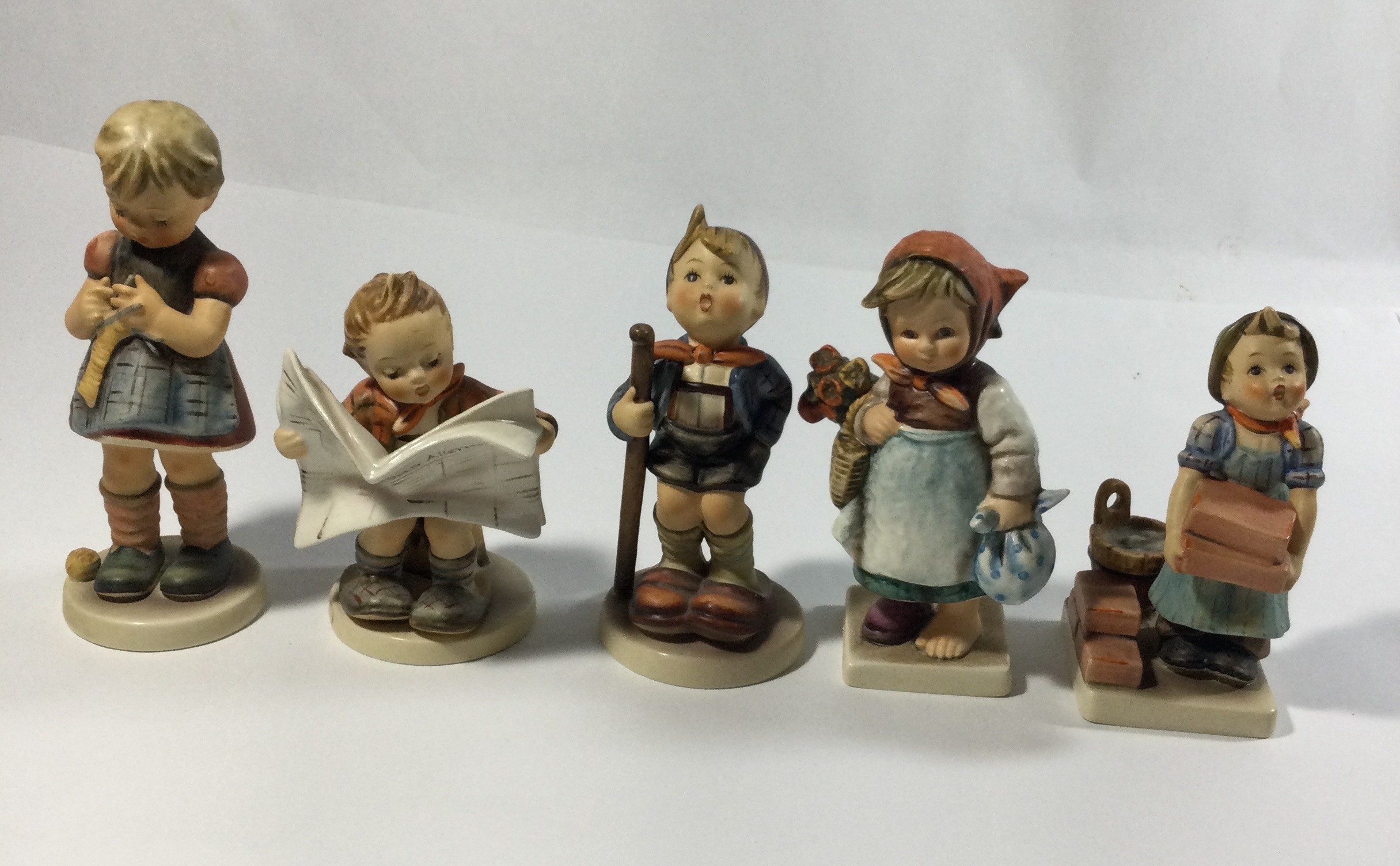 5 collectible Hummel figures,titledThe builder