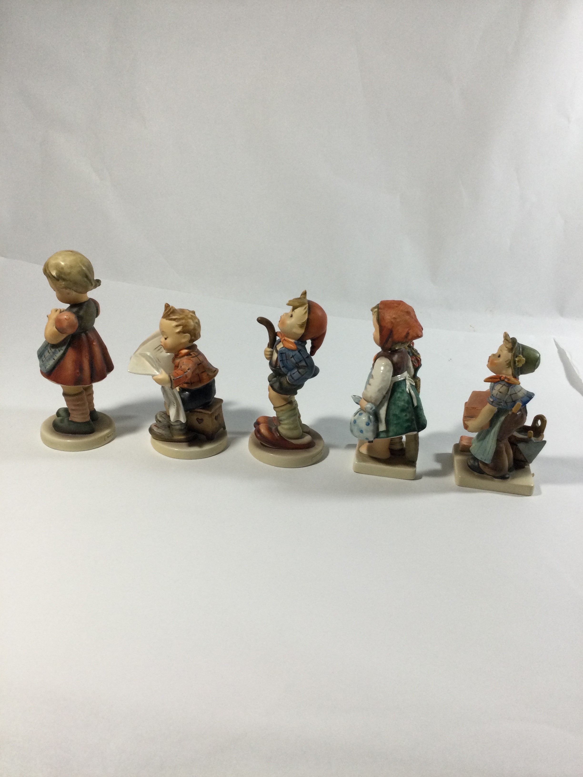 5 collectible Hummel figures,titledThe builder