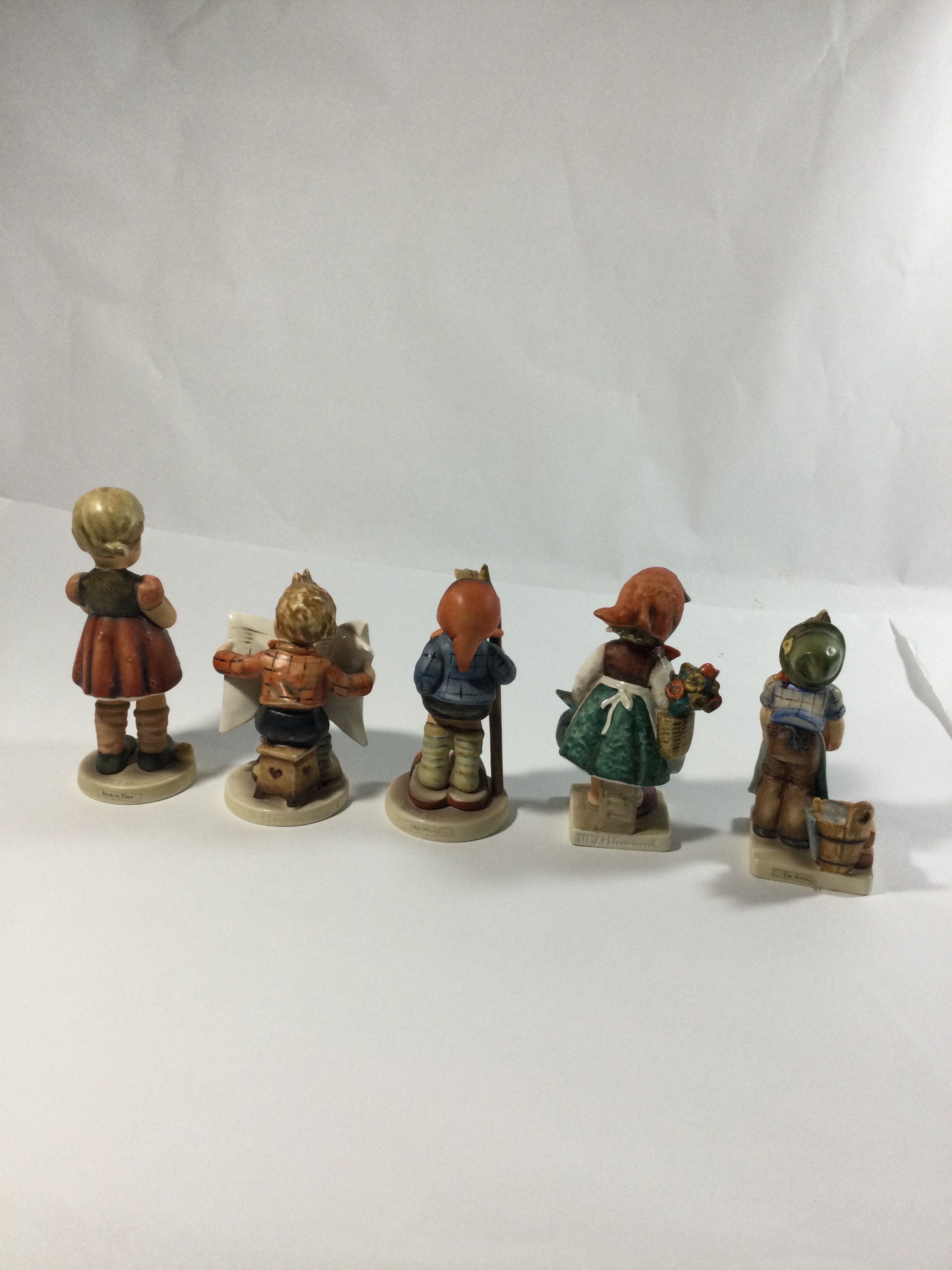 5 collectible Hummel figures,titledThe builder
