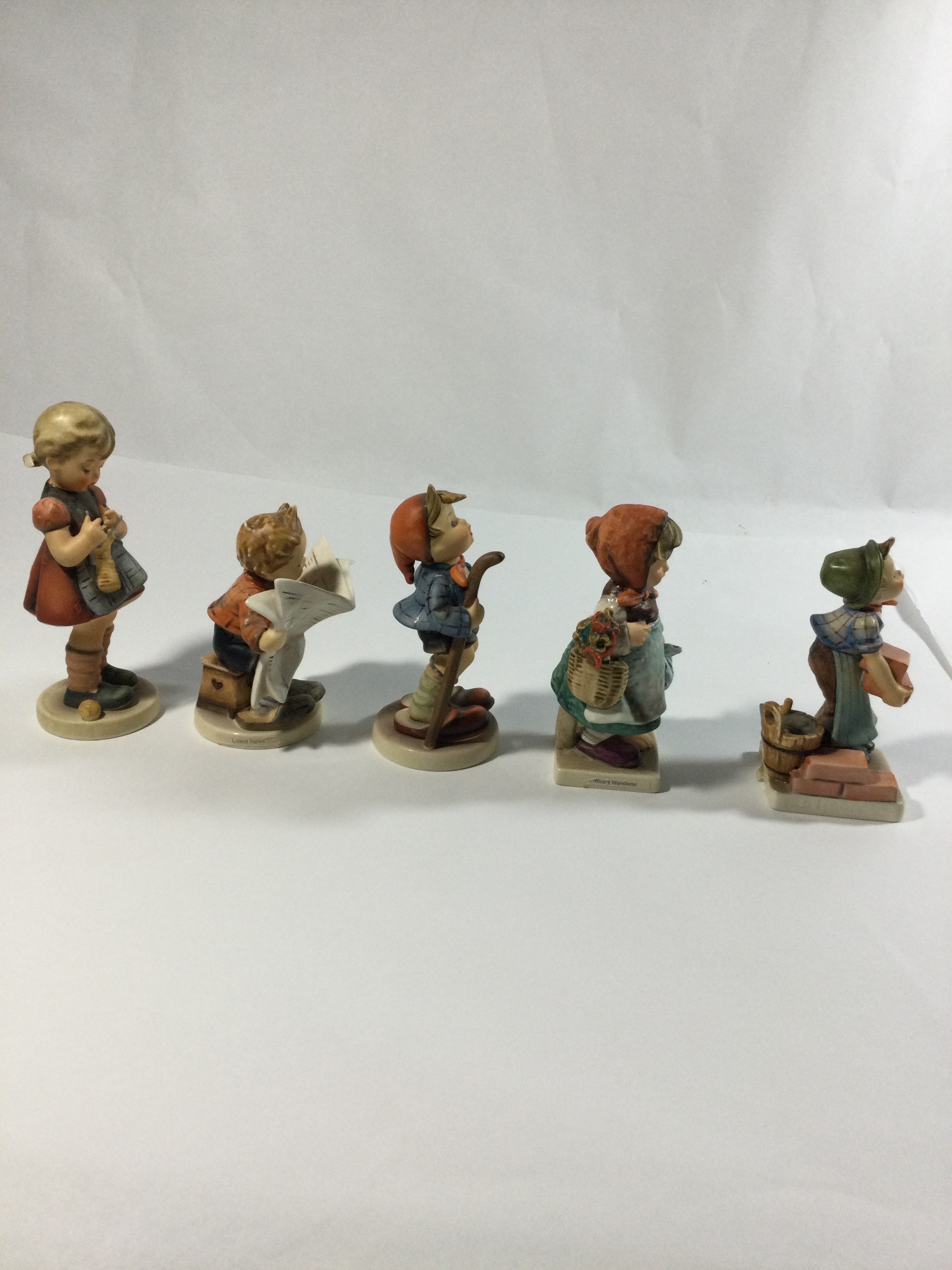 5 collectible Hummel figures,titledThe builder