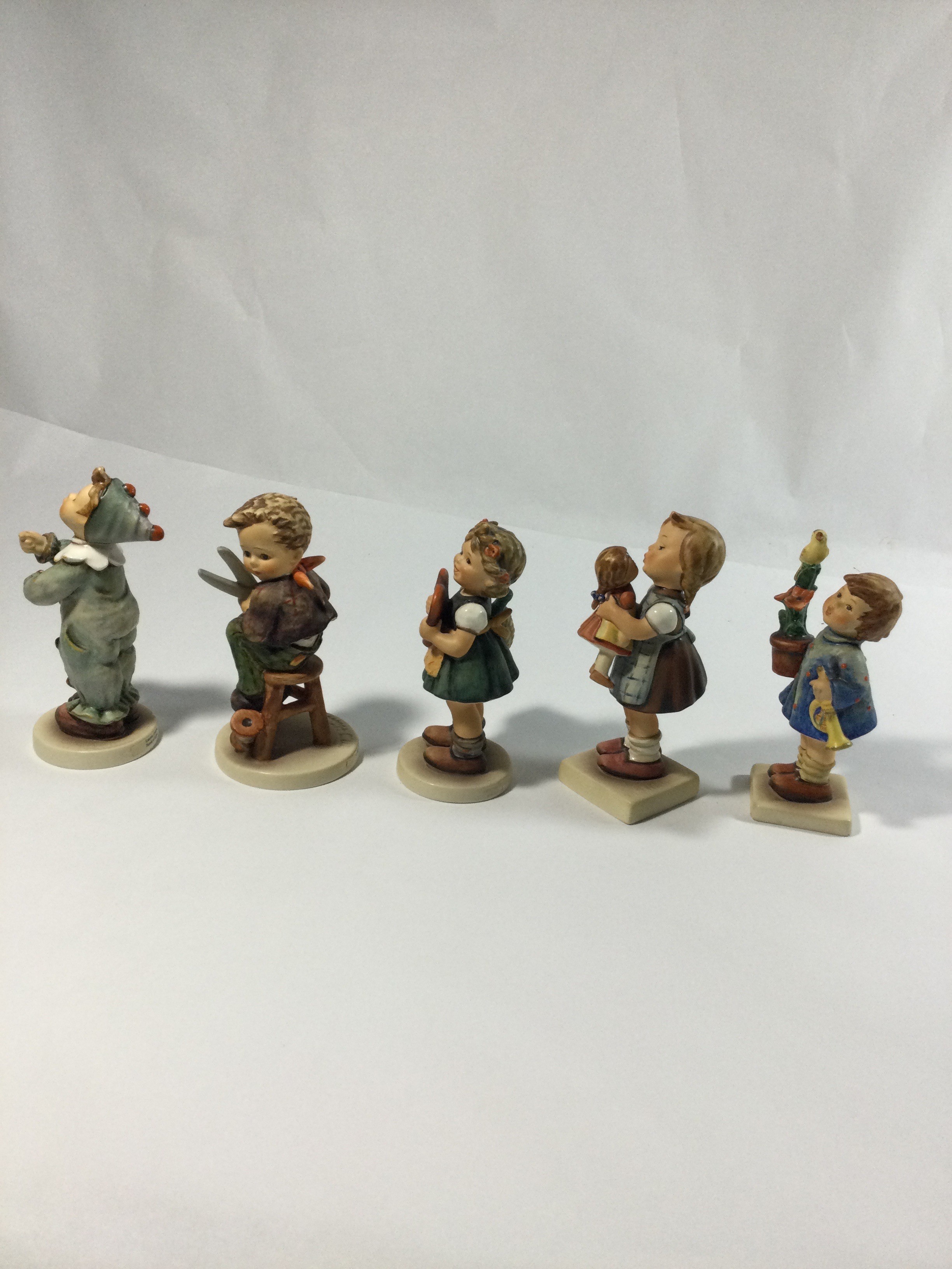 Five collectible Hummels figurines ,they are