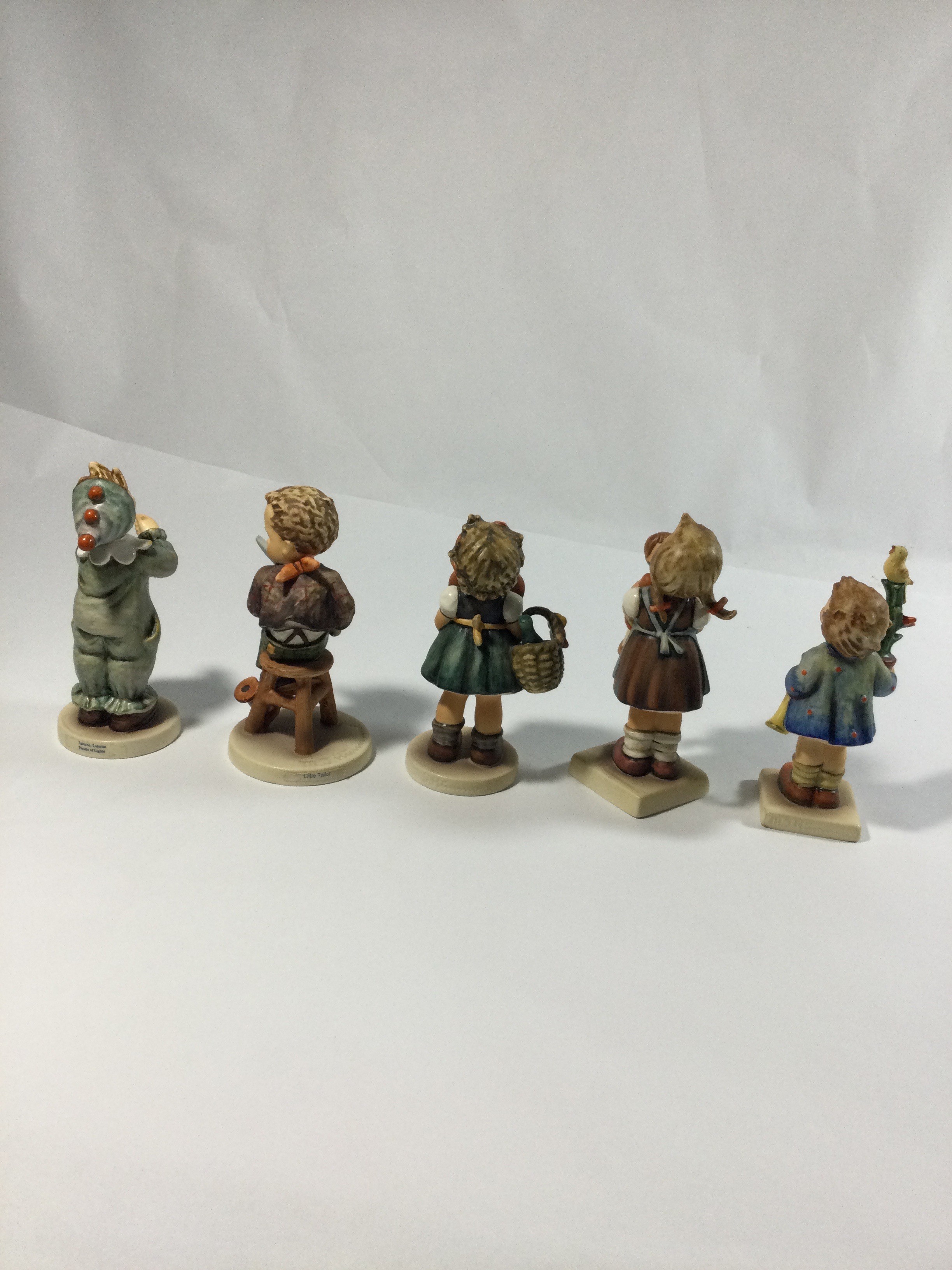 Five collectible Hummels figurines ,they are