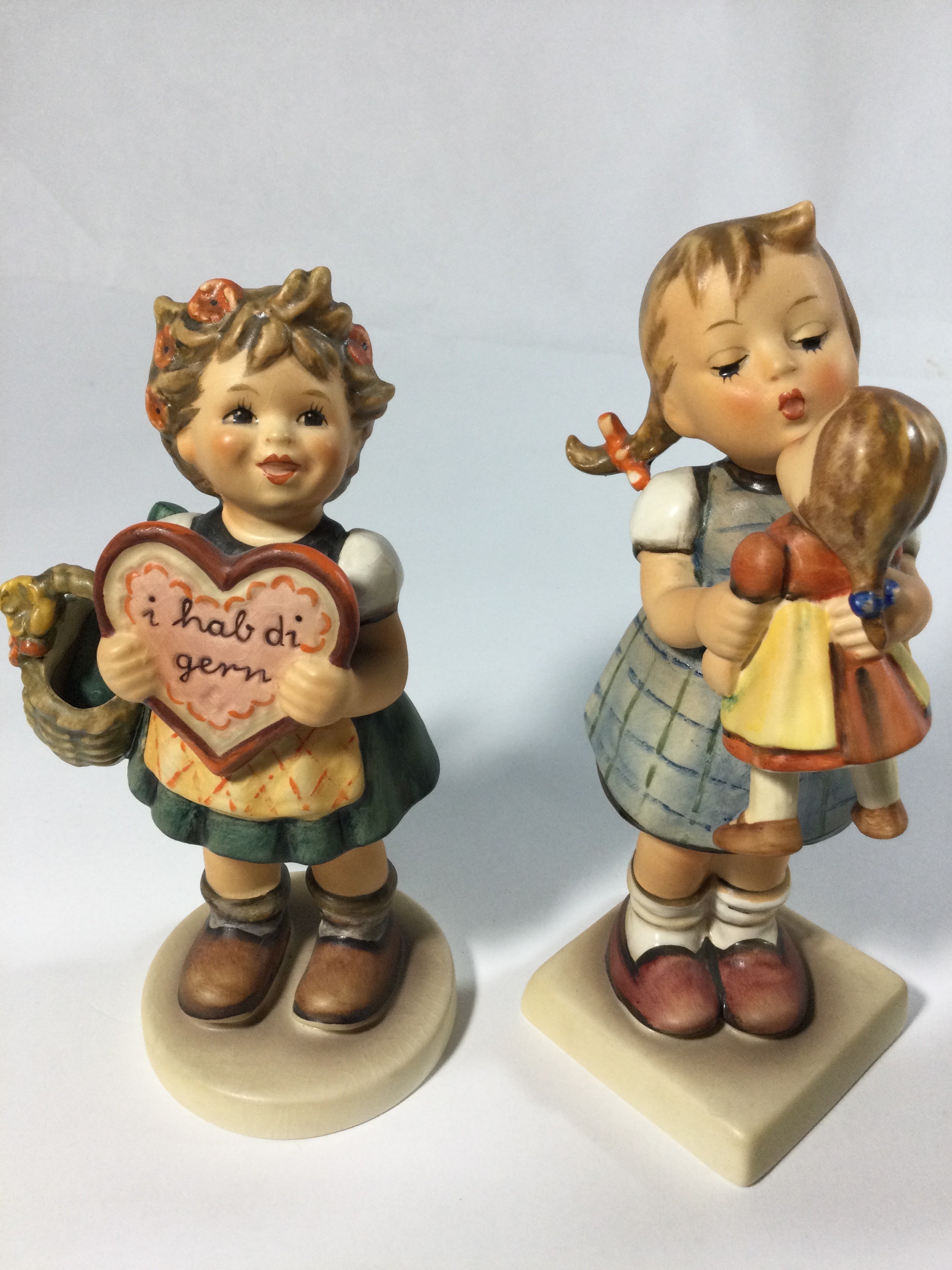 Five collectible Hummels figurines ,they are