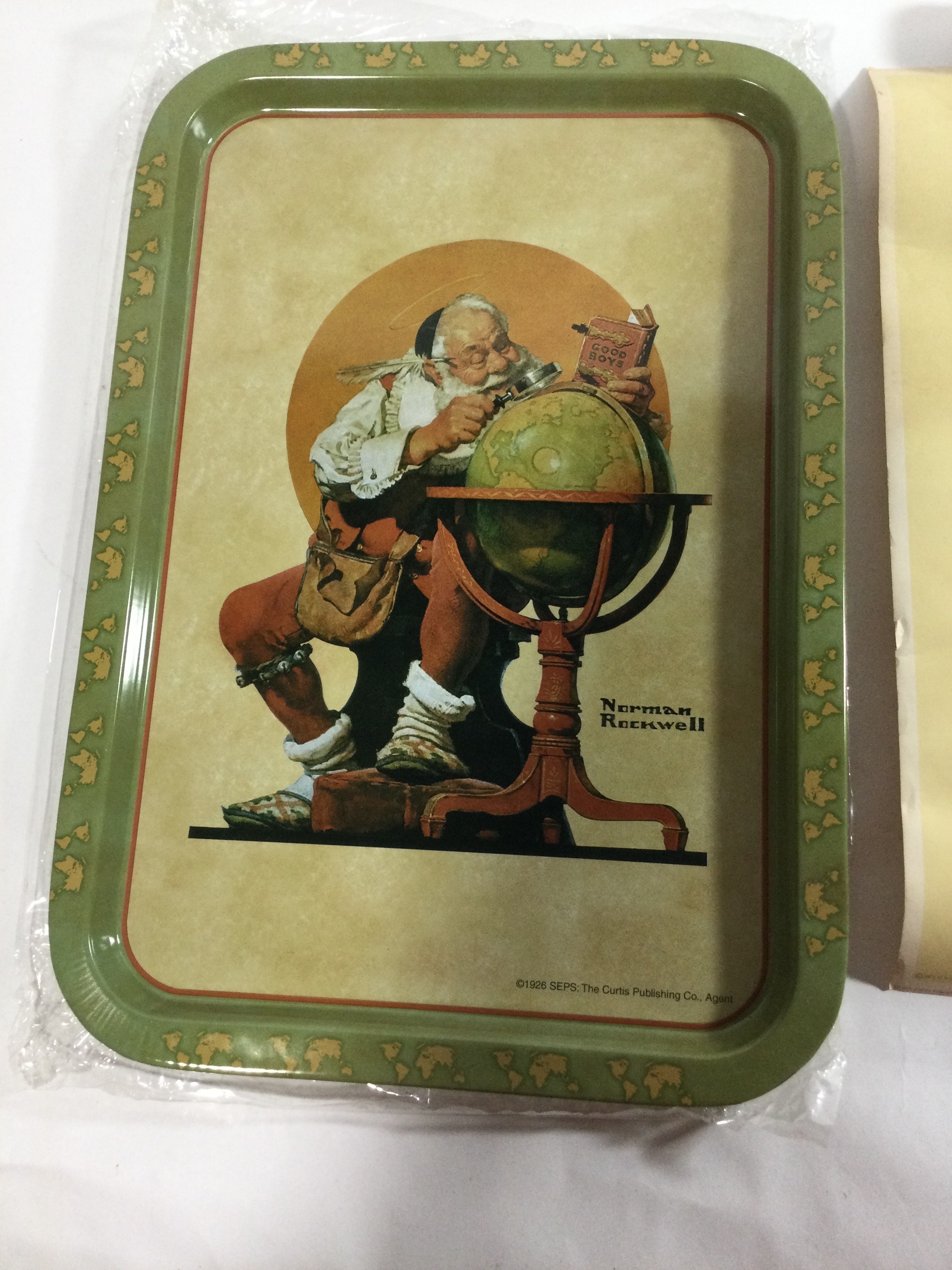 Norman Rockwell metal tray depicting Santa Klos