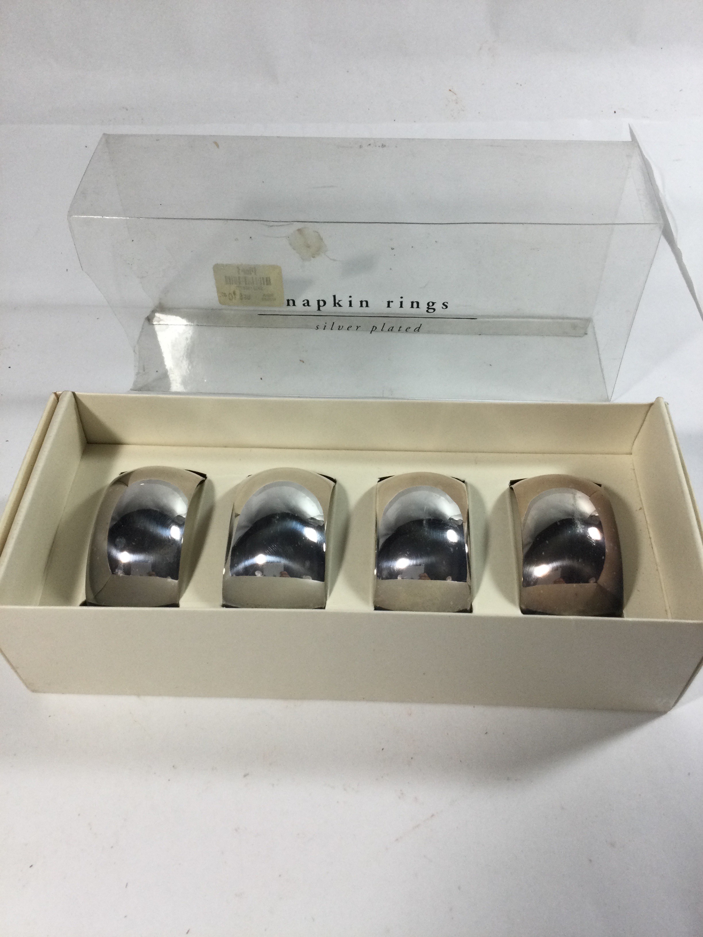 Four silver plated napkin rings