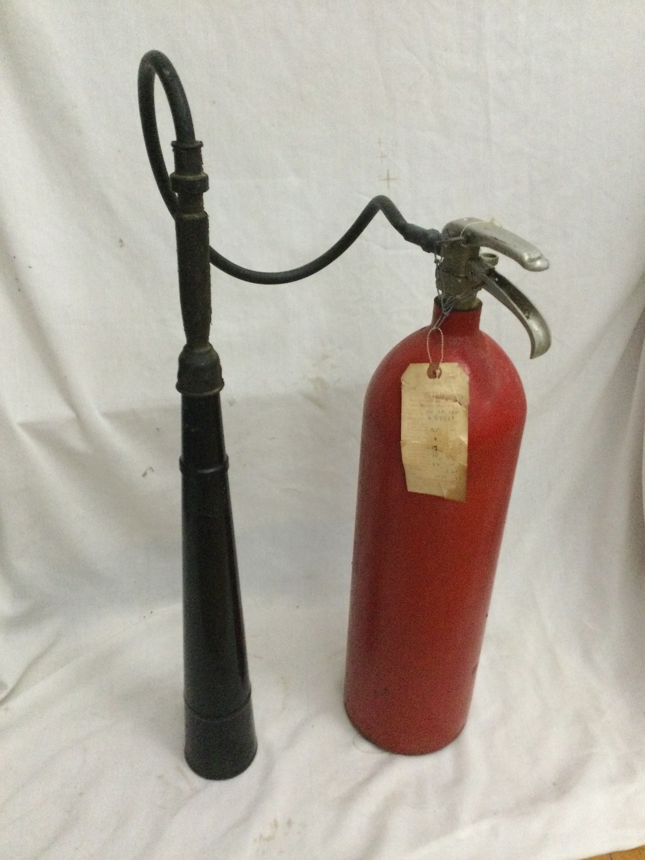 Vintage red carbon dioxide fire extinguisher from