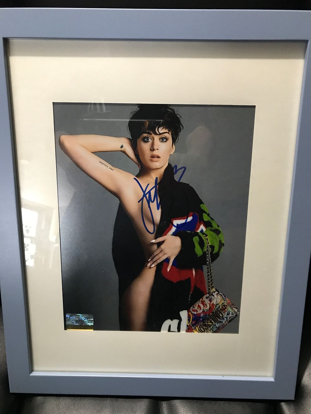 Lot 521: Katy Perry Autographed Semi-Nude Color Photograph