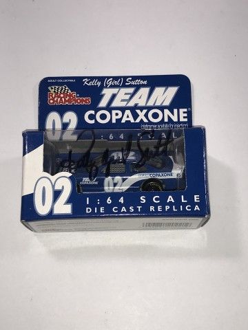 Lot 586: Autographed Kelly (Girl) Sutton #02 Team Copaxone 1:64 scale Diecast replica in box