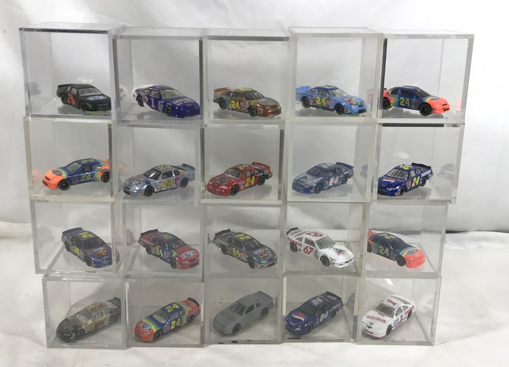 Lot 626: 25 Race Cars in collectible display cubes