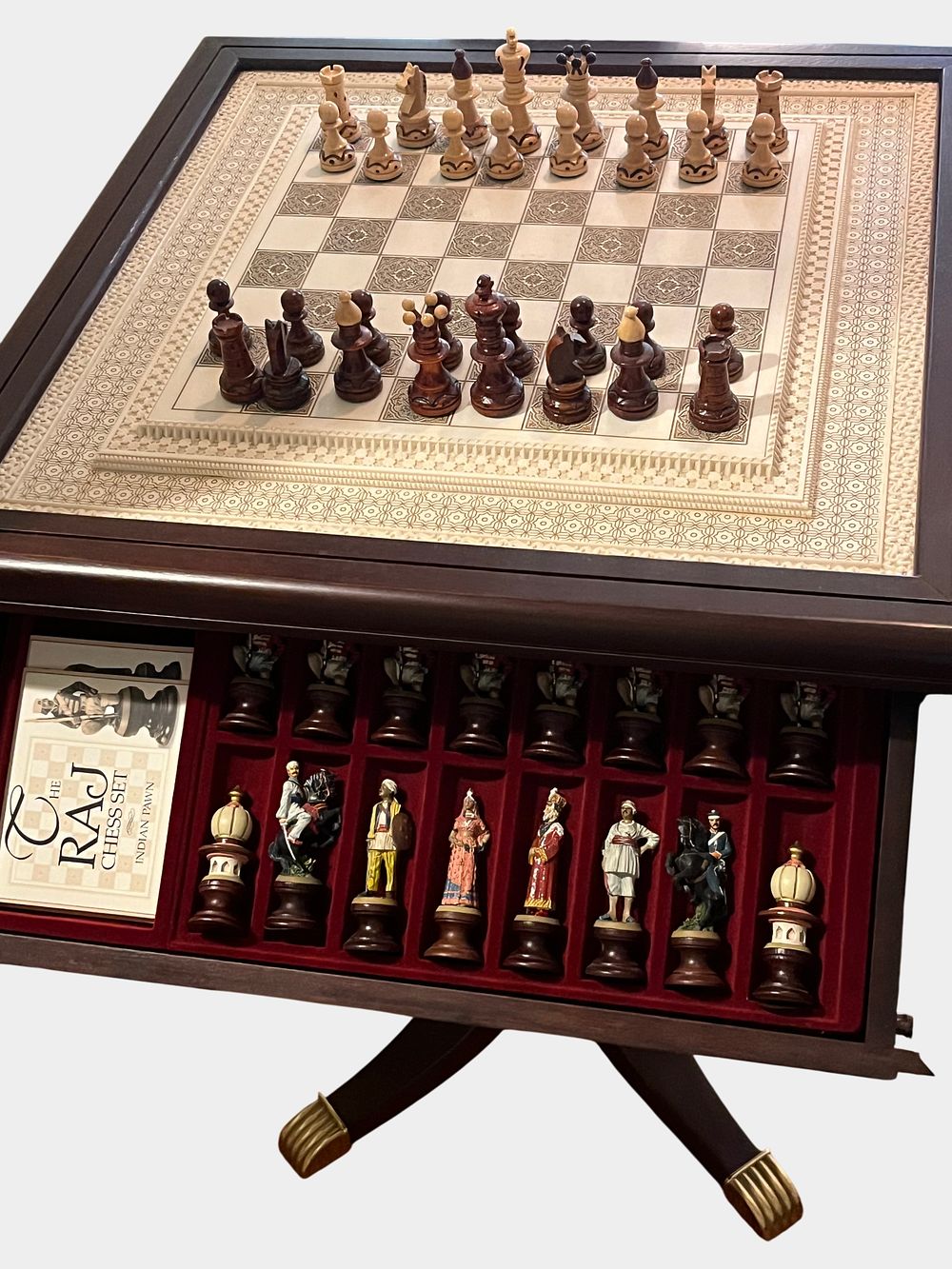 Lot 41: A Collection of Two Complete Chess Sets with Integrated Wooden Pedestal Storage Table