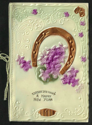 אגרת שנה טובה עשויה בקליט, כיתוב: "לשנה טובה התכתבו", כתובה באנגלית, תוצרת גרמניה