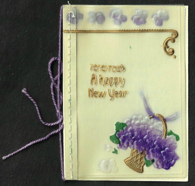 אגרת שנה טובה עשויה בקליט, כיתוב: "לשנה טובה", כתובה באנגלית, תוצרת גרמניה