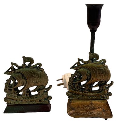 לוט ברונזה: 1. מנורת שולחן הנושאת תבליט של אוניה ועליה סמל המדינה. חלקה התחתון משמש כמאפרה 