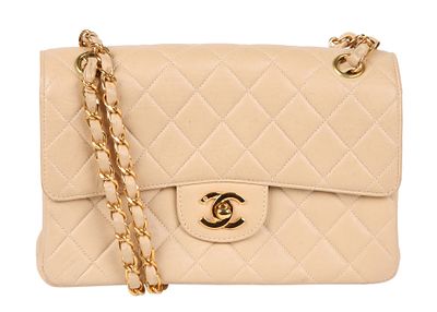 CHANEL MEDIUM TWO-SIDED DOUBLE FLAP SHOULDER BAG. Circa 96-97. Cream color lambskin leather. 