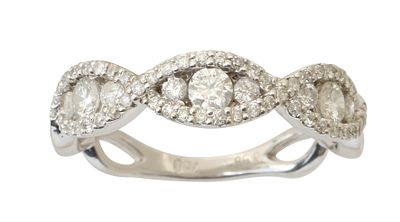 AN 18K WHITE GOLD RING. Set with graduated diamonds, total weight approx. 0.58 ct. Size approx. 