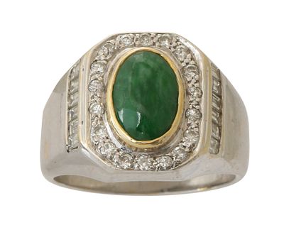 AN 18K WHITE GOLD RING. Frame set with small diamonds and centered with a green stone. Size 