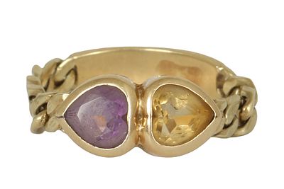 14K GOLD FLEXIBLE RING. Set with amethyst and yellow topaz. Size approx. US 8. Weight approx. 