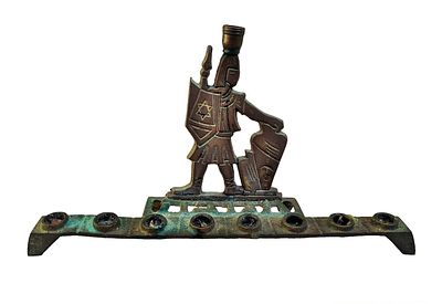 An interesting menorah with the image of the Maccabees, made of brass, made in Israel. 