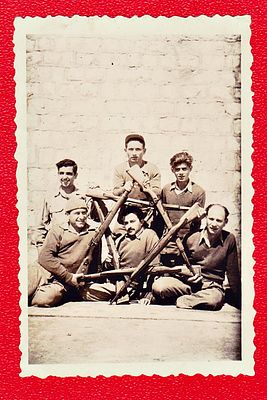 A group of IDF soldiers, probably from the War of Independence, brandish rifles in the shape of 