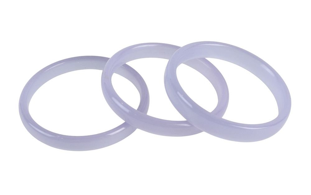 Lot 183: Three Lavender Hardstone Bangle Bracelets