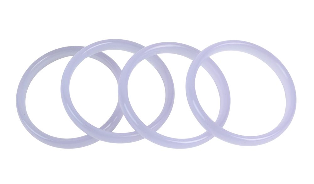 Lot 186: Four Lavender Hardstone Bangles