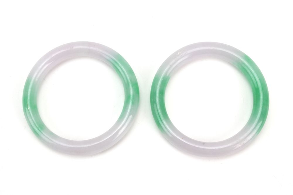 Lot 193: Pair Green & Lavender Jadeite Rings