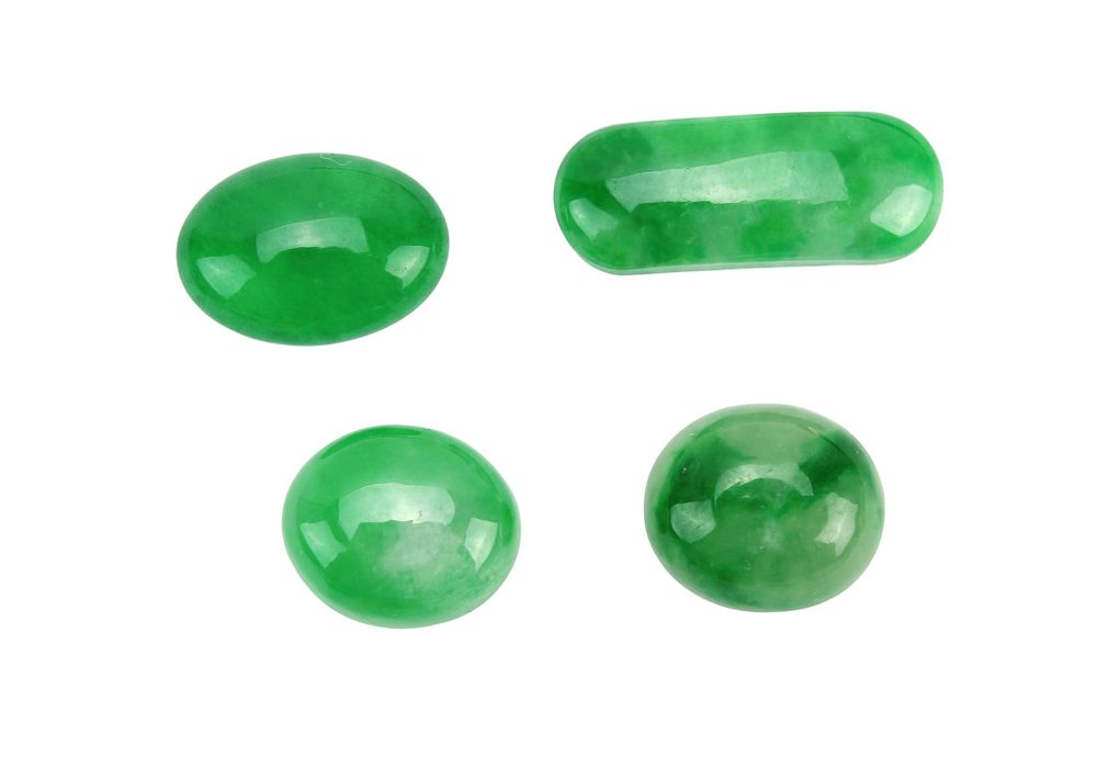 Lot 203: Group of Four Green Jadeite Buttons