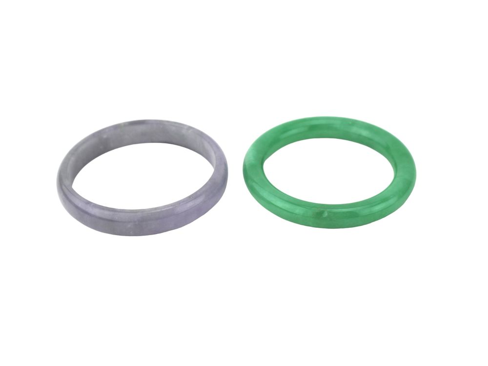 Lot 216: Two Green and Lavender Jadeite Bangles