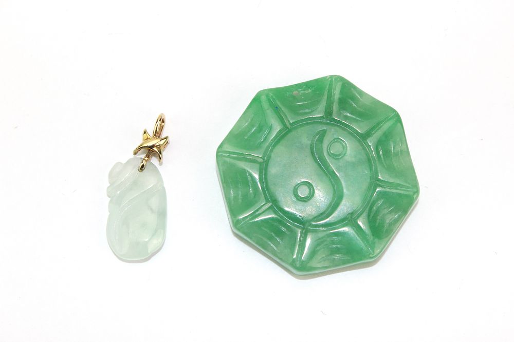 Lot 223: Two Carved Jadeite Pendants