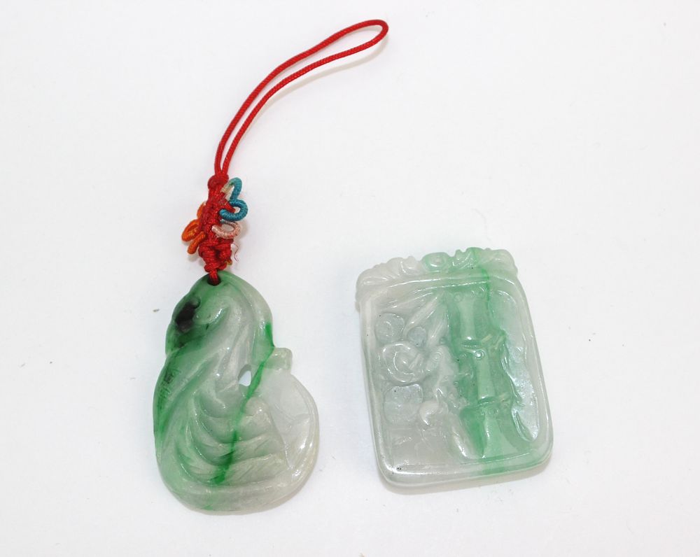 Lot 226: Two Carved Jadeite Pendants
