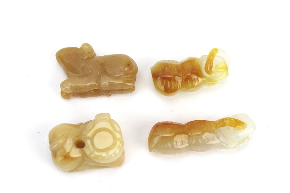 Lot 228: Group of Four Small Jade Pendants