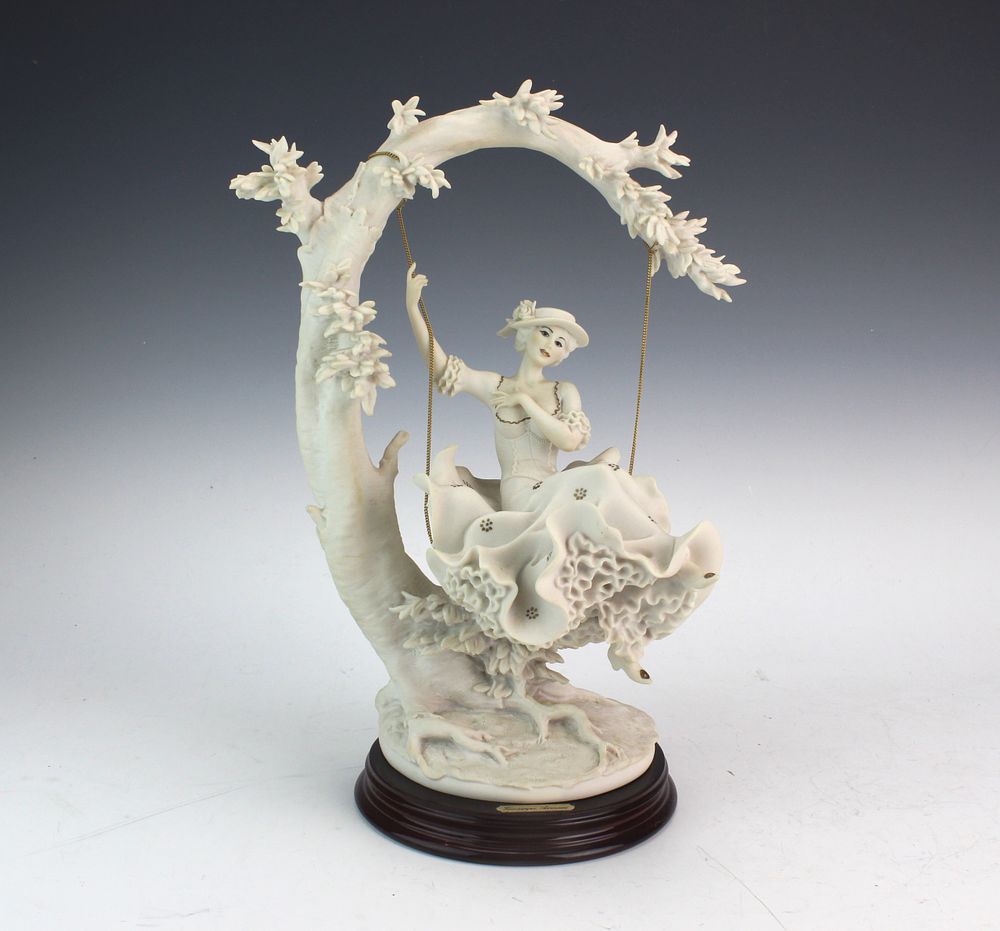 Lot 408: Armani Young Lady on Swing Figurine