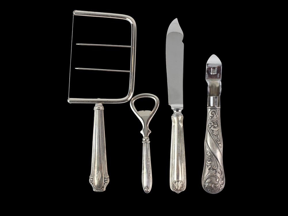 Lot 456: Four Sterling-Handled Kitchen Utensils Set