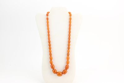 Amber Style Graduated Bead Necklace. Amber style graduated bead necklace with warm orange 