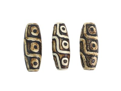 Set of Three Tibetan Nine-Eye Dzi Beads. Group of three cylindrical agate Dzi beads featuring 