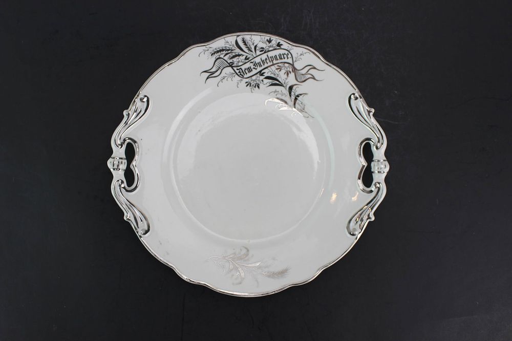 Lot 259: One White Porcelain Plate With Silver Edge