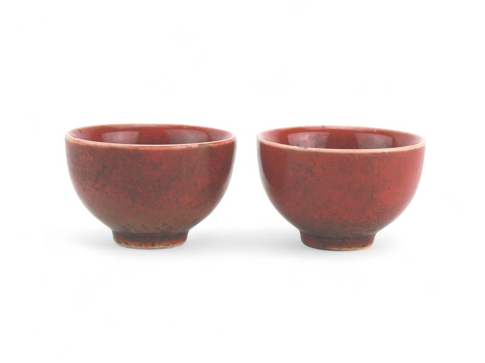 Lot 389: Two Chinese Oxblood  Glazed Tea Cups