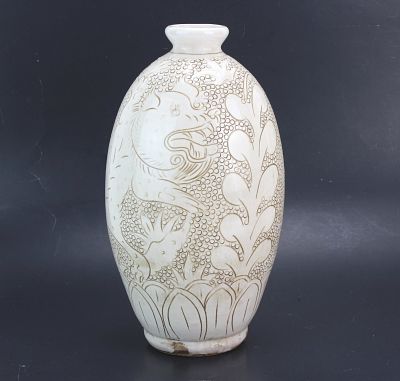 Chinese Incised White Glaze Vase. Chinese porcelain vase of ovoid form with short neck 