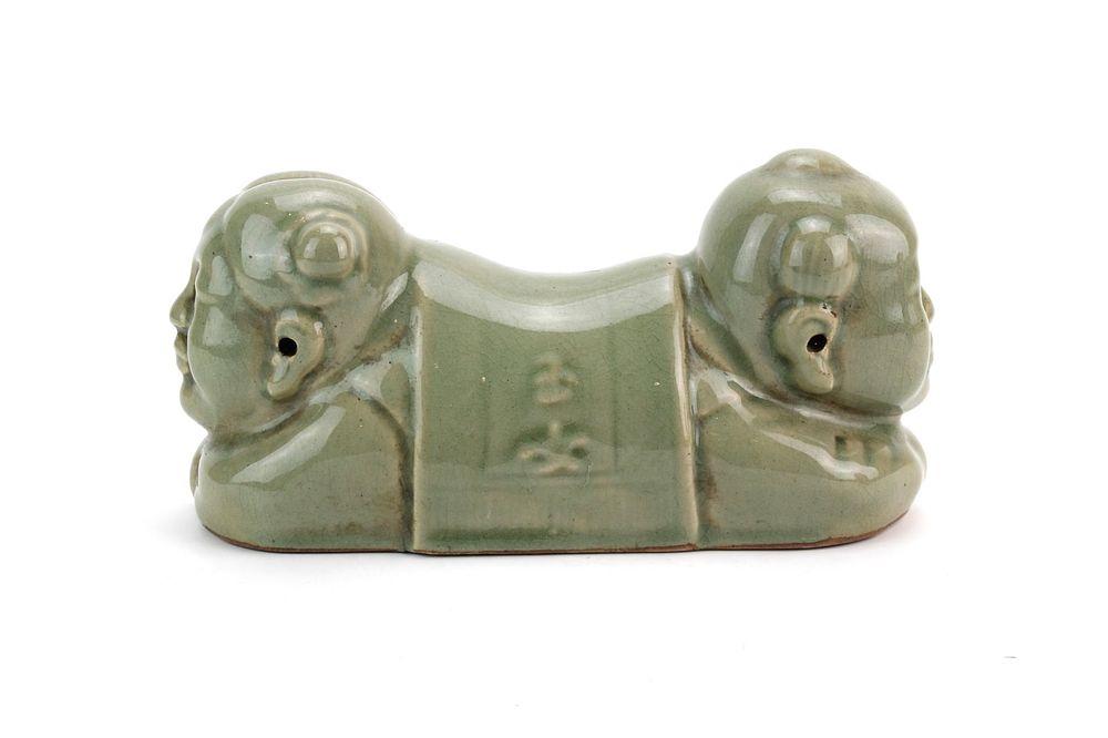 Lot 434: Chinese Celadon Figural Hand Pillow