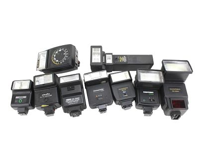 NINE VARIOUS CAMERA FLASHES. Includes: 1) one Montgomery Ward ATB-50 flash; 2) one Focal 